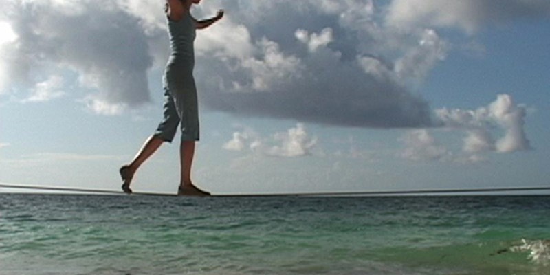 Still from Touch - a woman balancing